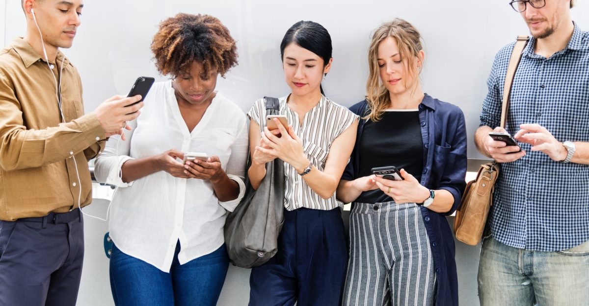 Employees checking social media at work.