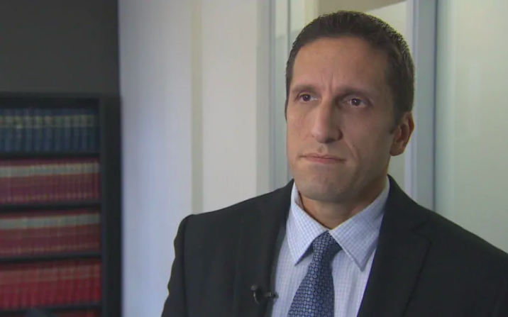 Employment Lawyer Lior Samfiru, Co-founding Partner at Samfiru Tumarkin LLP, conducts and interview with an off-camera reporter in the law firm's boardroom.