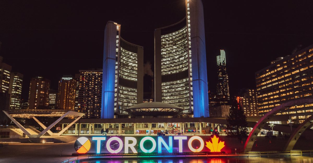 A photo of City Hall in Toronto at night.