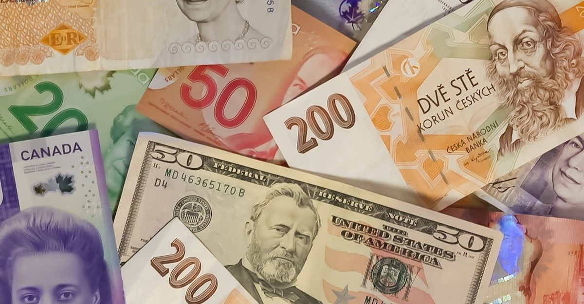 An assortment of currency from around the world. TD Bank employees are entitled to severance pay when they lose their job.
