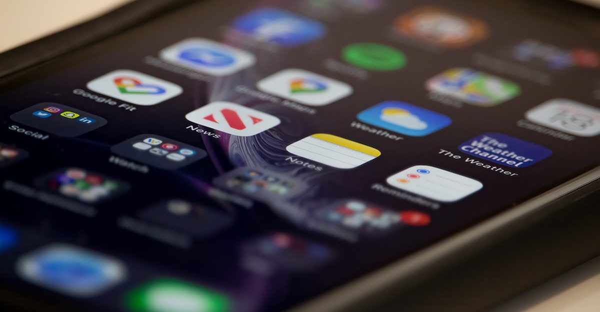 Dozens of apps are displayed on a smartphone screen. Twitter Canada employees are entitled to severance pay when they lose their job.