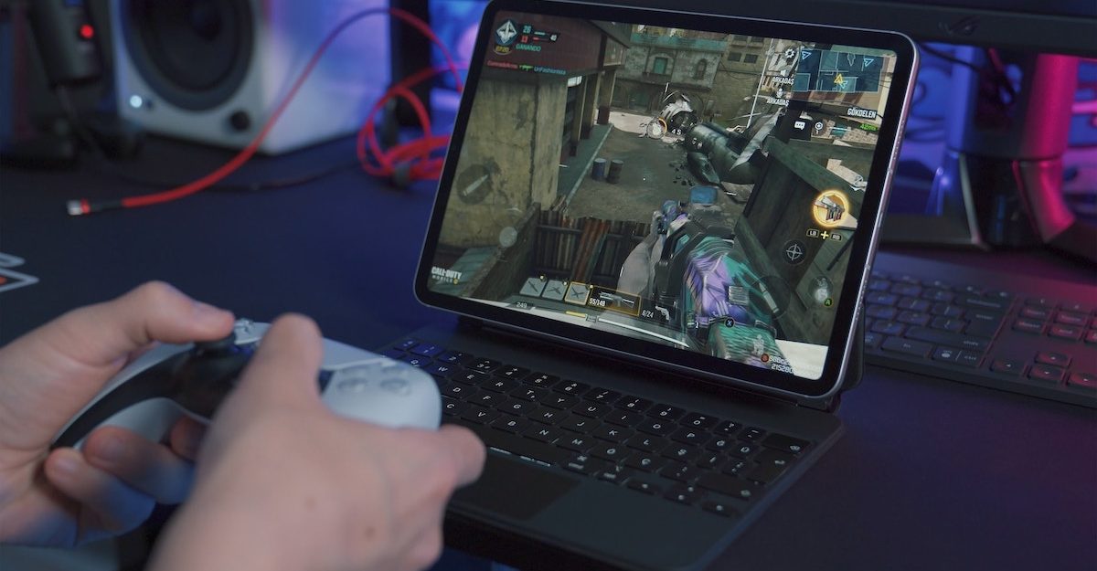 Someone uses a controller to play a video game. CD Projekt RED owes severance pay to employees who lose their job.