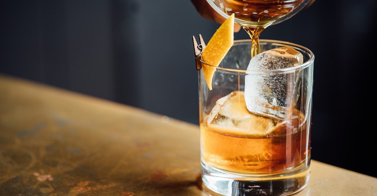 A shot of spirit is poured into a transparent drinking glass. Diageo Canada employees are entitled to severance pay when they lose their job.