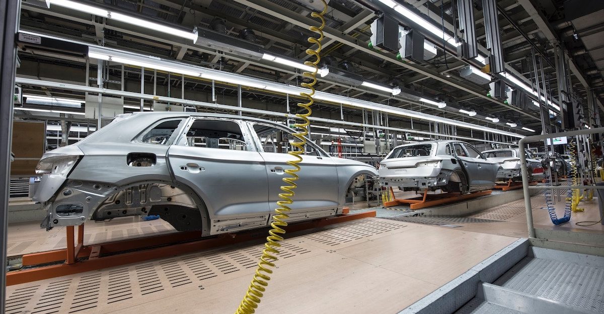 Unfinished car chassis on an automotive production line. Employees in the automotive industry are entitled to severance pay when they lose their job.