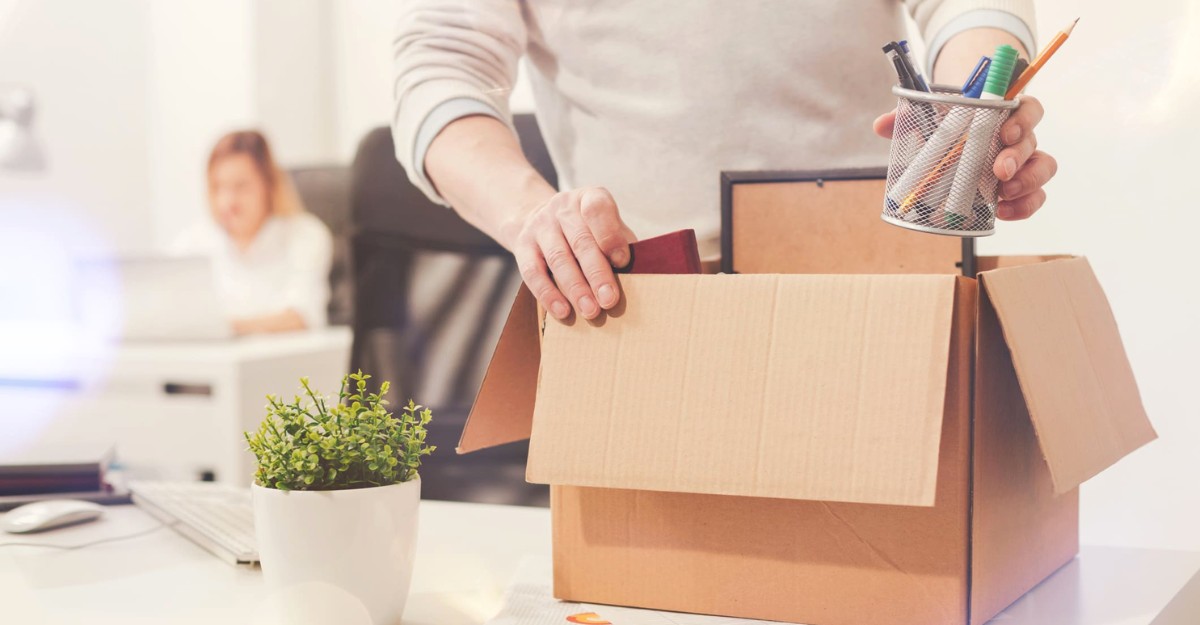 A photo of an employee clearing their desk after being let go. (Photo: Crunch Accounting / Google Images)