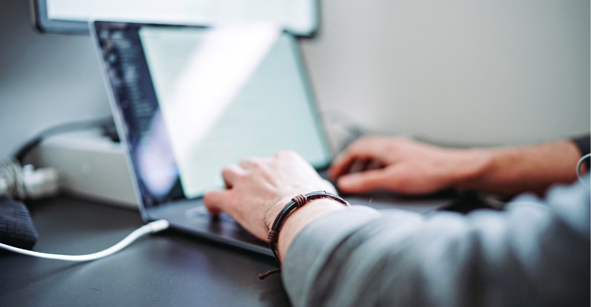 A photo of a person using a laptop. (Photo: Zanilic / Unsplash)