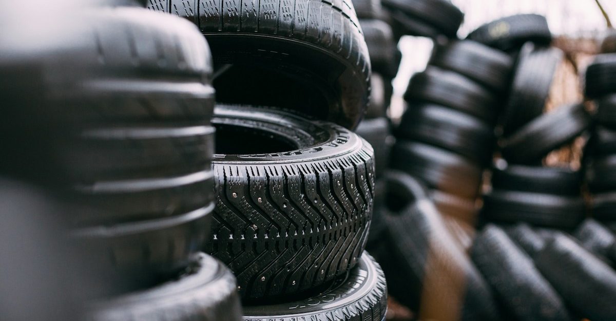 Stacks of tires, like those distributed by Group Touchette and its subsidiaries.