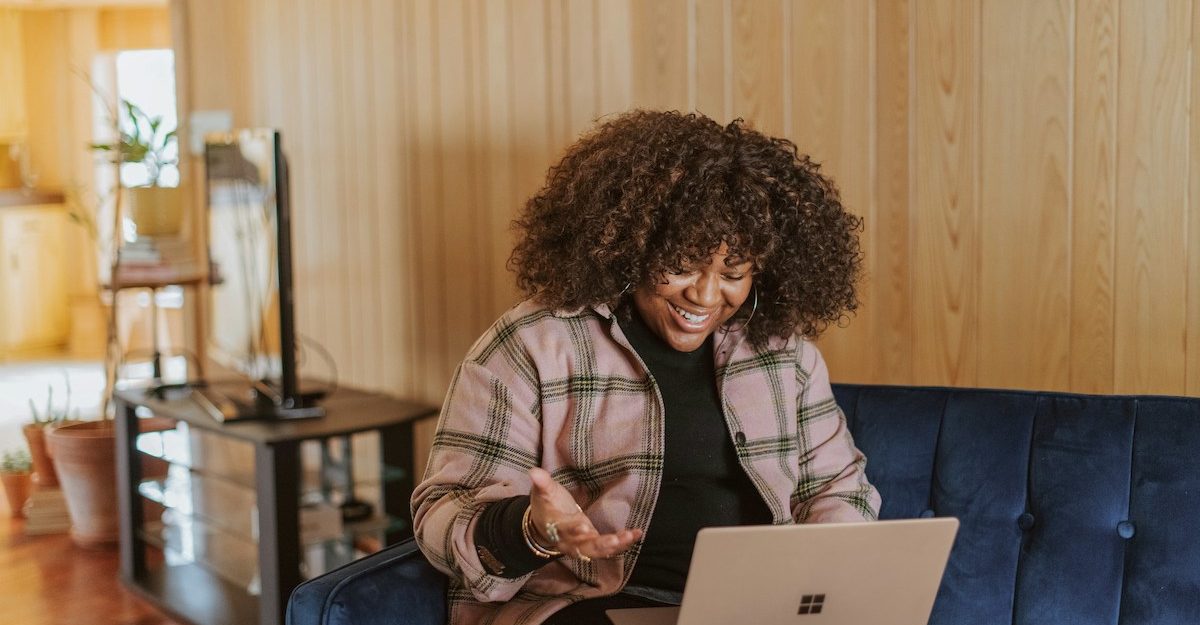A woman enjoys remote work.