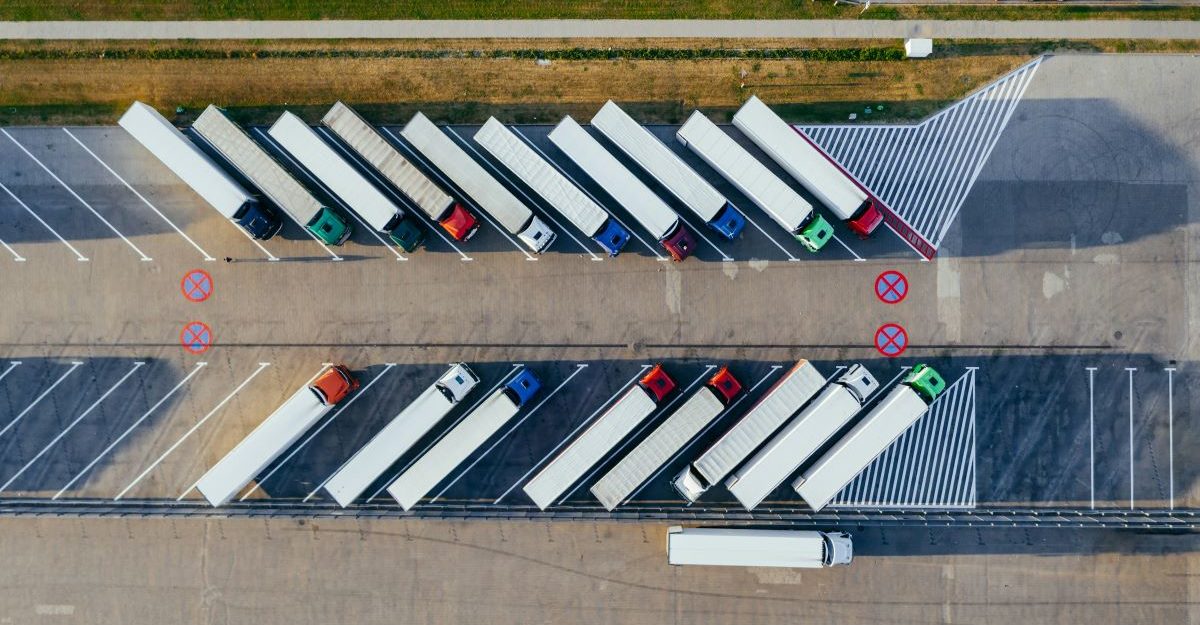 A number of parked transport trucks, potentially operated by Gordon Food Service.