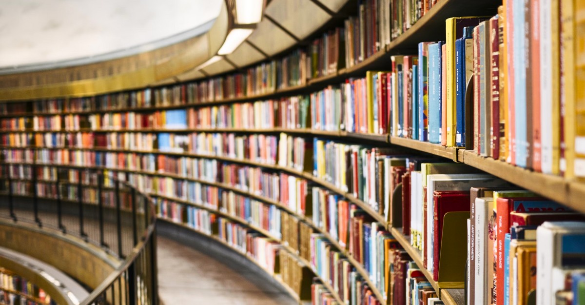 A photo of books on circular bookshelves. (Photo: Susan Q Yin / Unsplash)