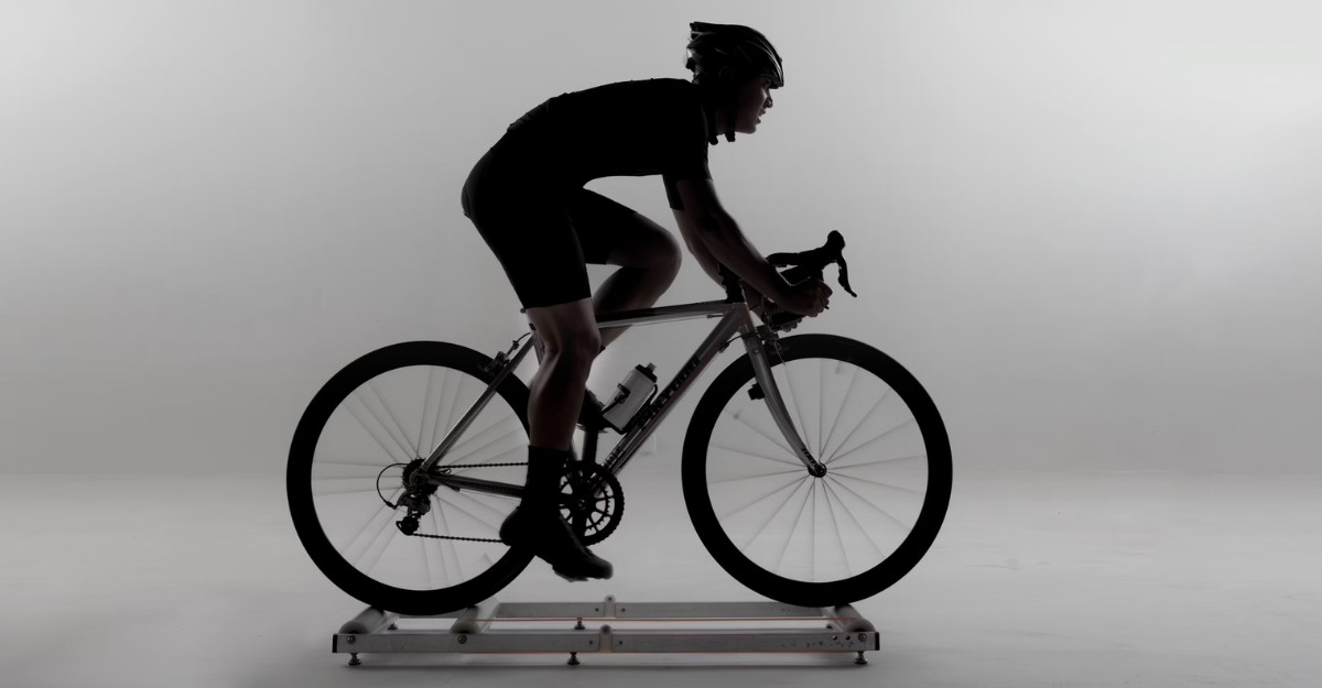 A photo of a person on a stationary bicycle. (Photo: Aditya Wardhana / Unsplash)
