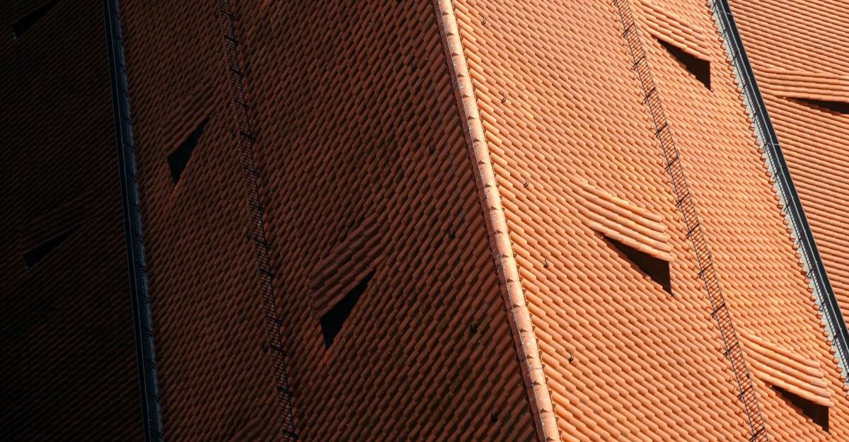An aerial shot of a well-maintained Spanish tile roof.