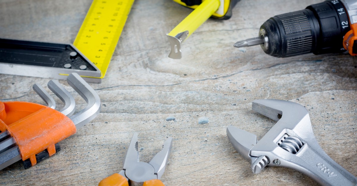 A photo of various tools on a wooden floor. (Photo: bermixstudio / Unsplash)