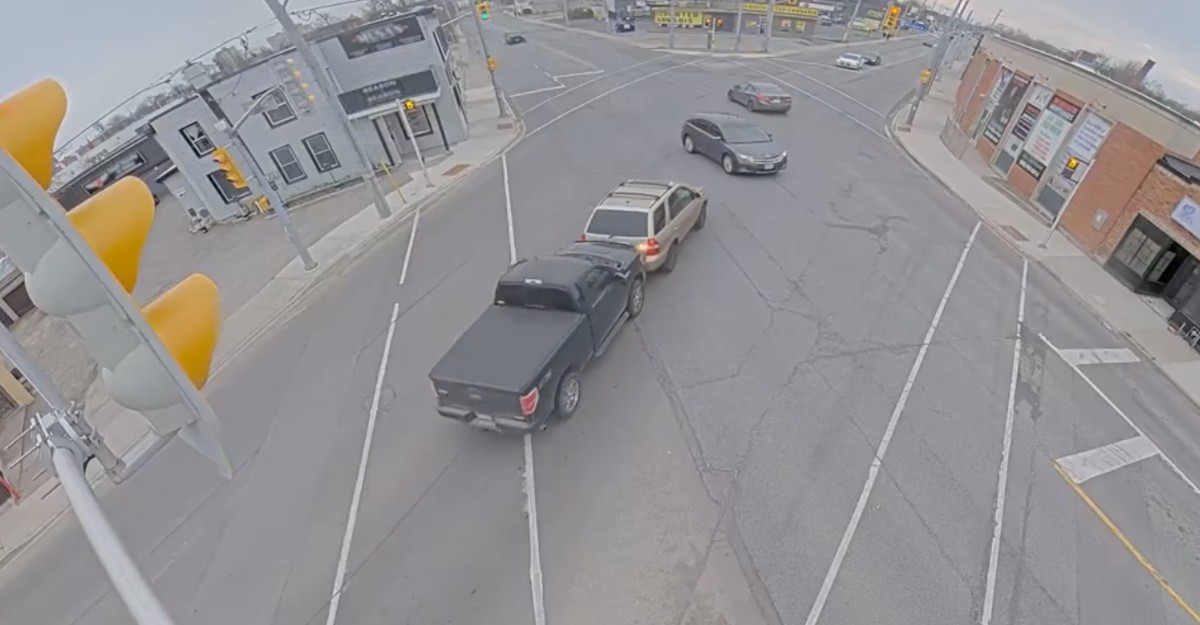 A photo of a black Ford F-150 pushing a beige SUV through an intersection in St. Catharines on March 23, 2025. (Photo: @NRPS / X/Twitter)