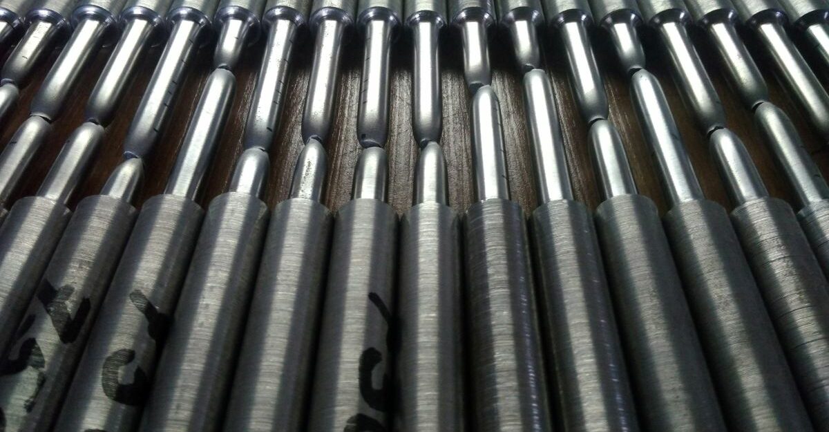 Multiple pieces of metal organized on a platform.