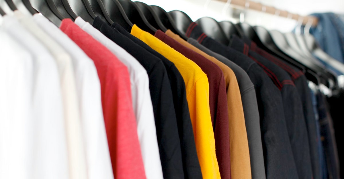 A photo of clothing on a rack. (Photo: Parker Burchfield / Unsplash)