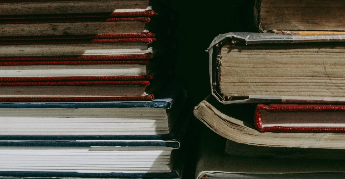 A photo of textbooks stacked on top of each other. (Photo: hubiita / Unsplash)
