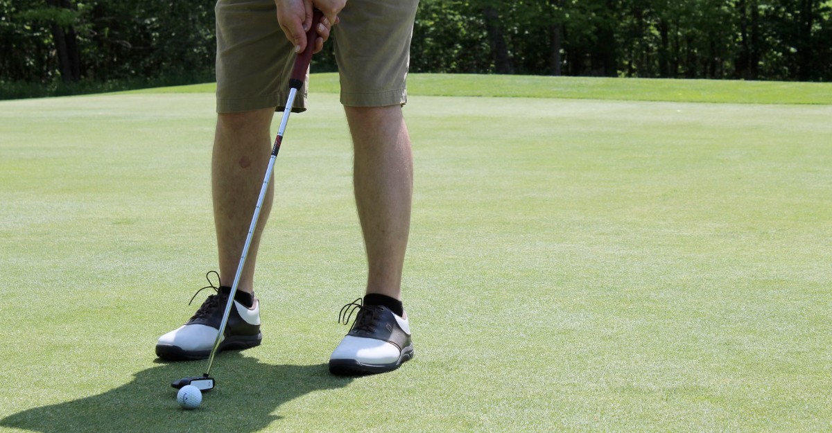 A photo of a person about to use a putter on a golf course. (Photo: tristin zeman / Unsplash)