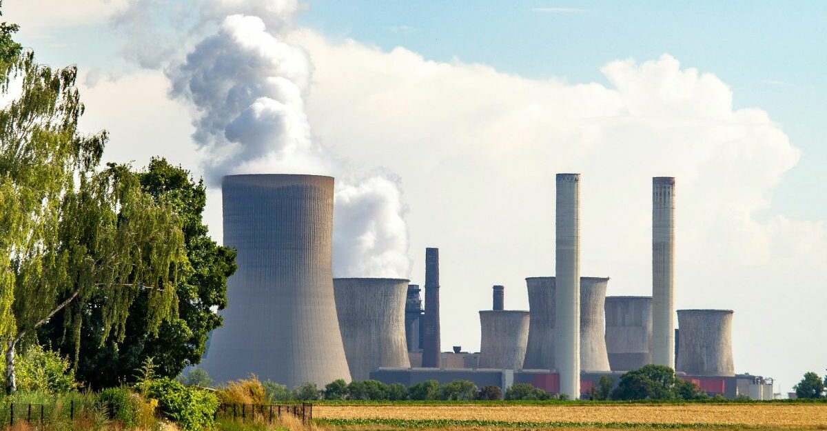 smoke billows out of a nuclear power station.