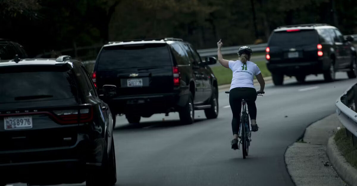 Virginian Julie Briskman gives US President Donald Trump's motorcade the middle finger as it passes by.