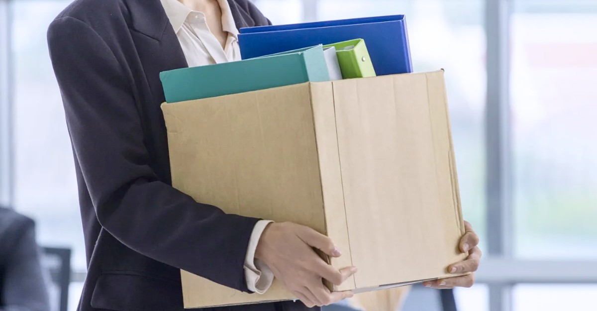 A photo of a terminated employee leaving with their office supplies. (Photo: Getty Images)