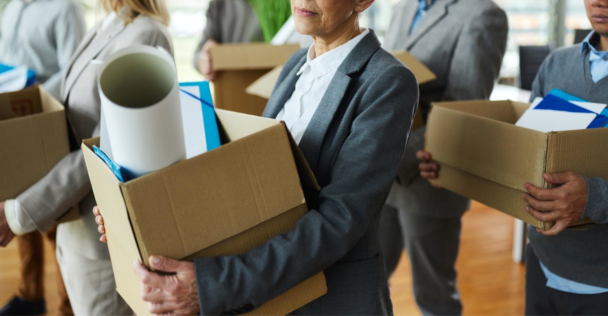 Multiple employees with cardboard boxes in their hands. (Photo: MarketWatch / Google Images)