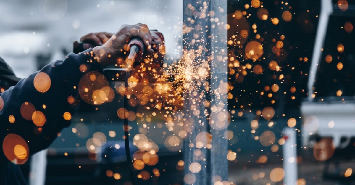 A person operating a piece of machinery. (Photo: Christopher Burns / Unsplash)