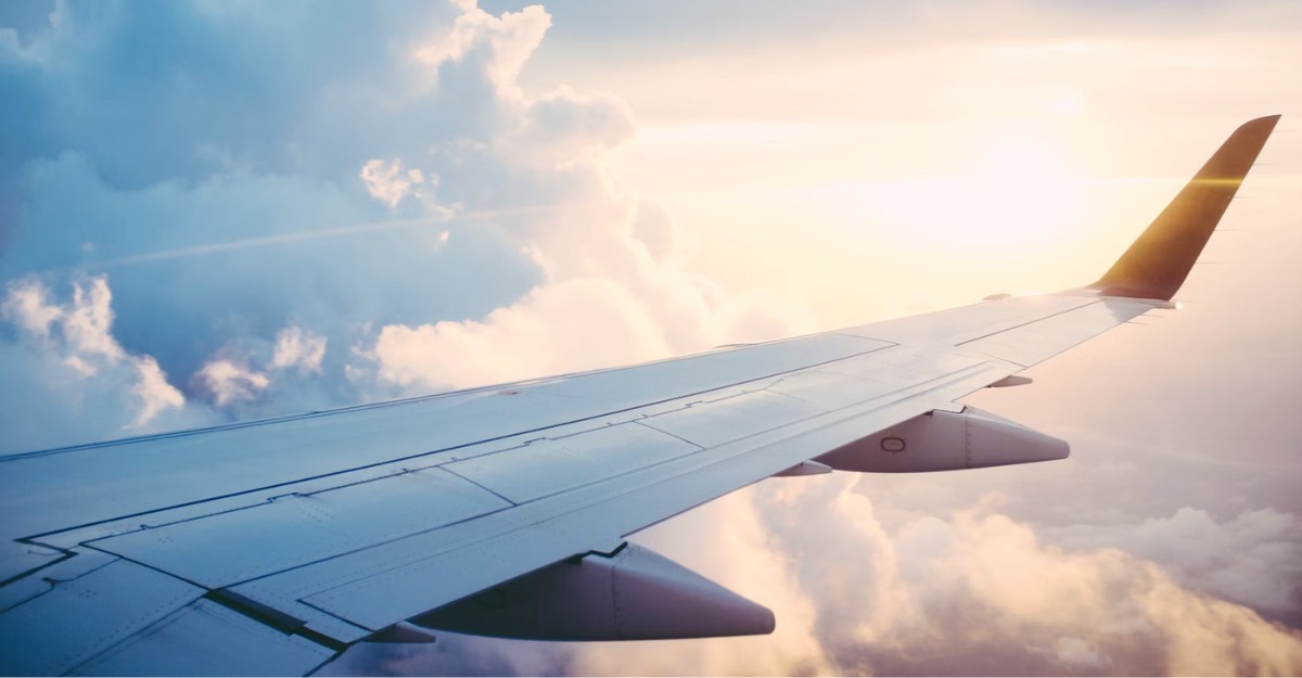 An aerial photo of an airplane wing. (Photo: Ross Parmly / Unsplash)