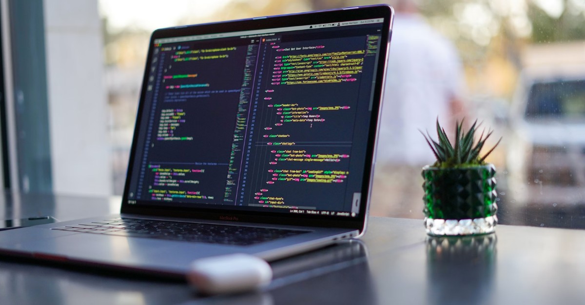 Code on a laptop near a window. (Photo: James Harrison / Unsplash)