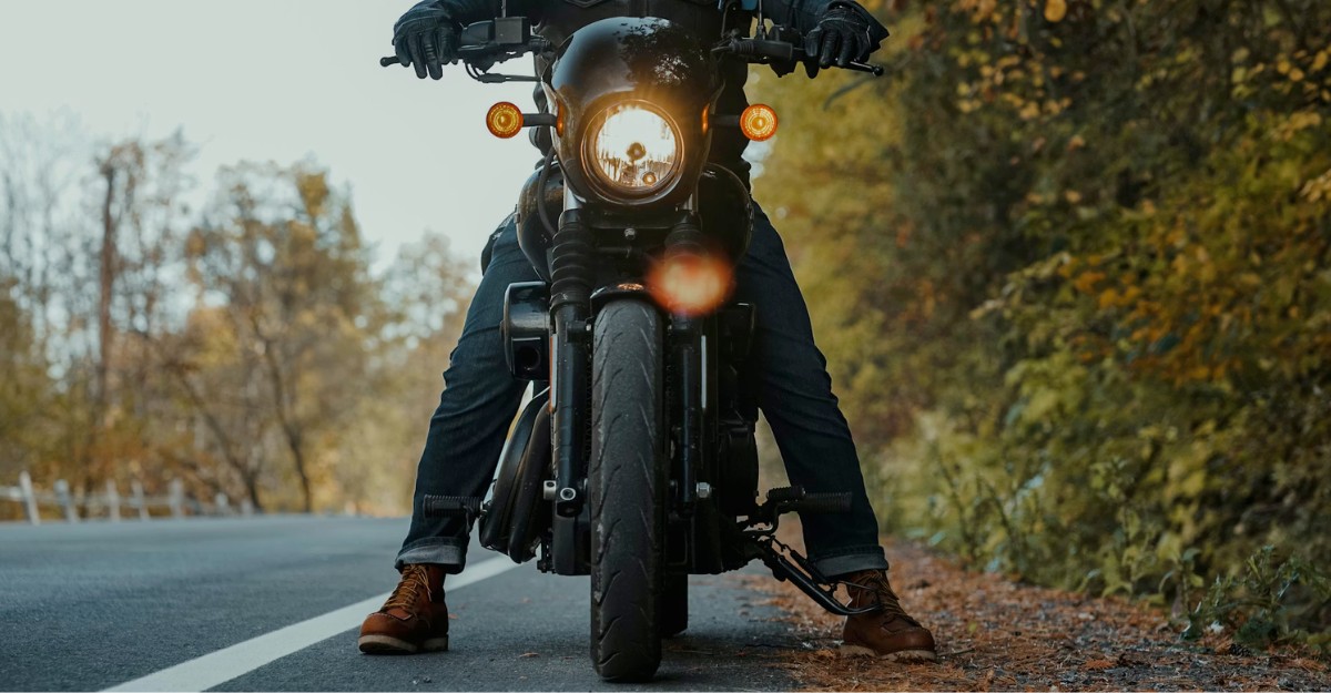 A motorcycle on the side of the road. (Photo: Mike Montgomery / Unsplash)