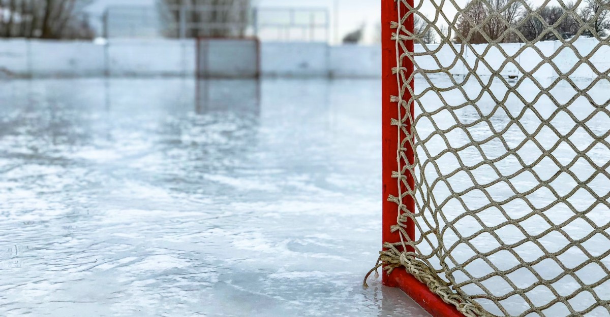 Two hockey nets on an outdoor ice rink. (Photo: Chris Liverani / Unsplash)